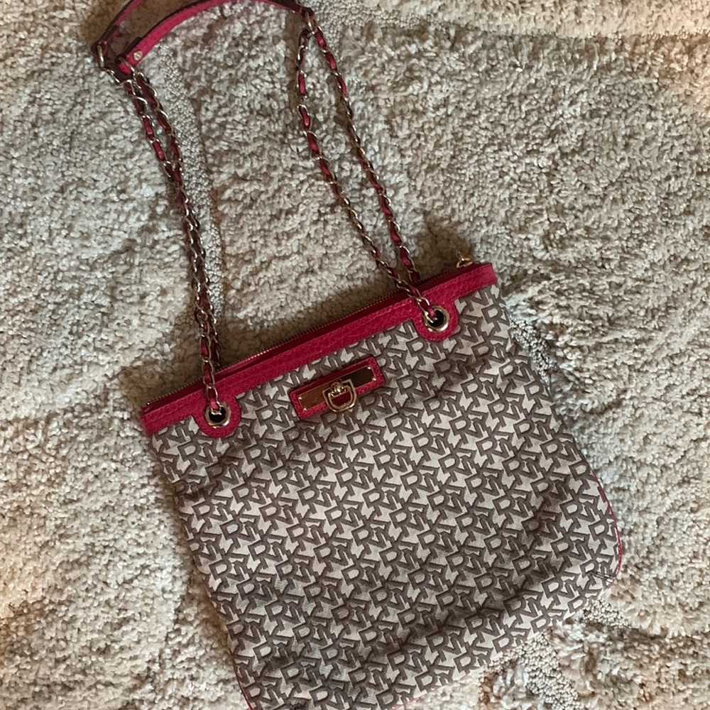 NWOT DKNY Signature print purse with pink and gold accents